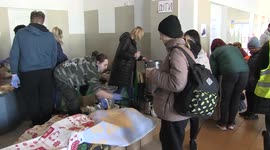 Refugees fleeing Ukraine given food and shelter at railway station in eastern Poland