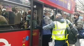 Frustration and overcrowding as passengers jam themselves onto a bus amid London tube strike