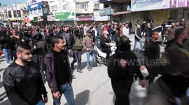 Mourners carry bodies of two Palestinian, who were killed by Israeli forces, during a funeral