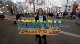 Female protester supports Ukraine flower's are better than bullets