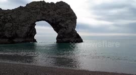 Durdle Door and Beach, a Natural Limestone Arch in Dorset, England