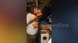 Birthday cake fail causes candles to set fire to woman's hair