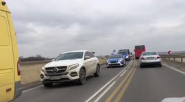 A convoy of buses and cars with Ukrainian refugees enter Poland