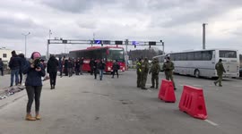 Refugees from Ukraine enters Poland in full buses. Poland army helps