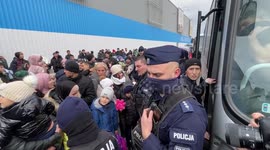 Tensions high as refugees from Uzbekistan attempt to board bus taking them to the airport after being evacuated from Ukraine
