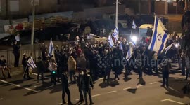 Israeli right-wing settlers wave Israel national flags in the east Jerusalem neighborhood of Sheikh Jarrah