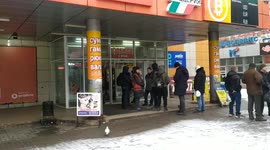 Ukrainians queue for hours to buy essentials in embattled city of Kharkiv