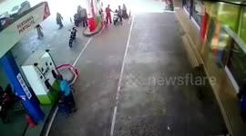 Out-of-control car topples over in petrol station in Indonesia