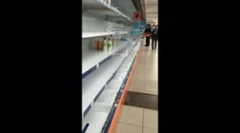 Bare shelves in embattled Ukrainian city as shopper panic buy