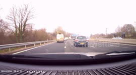 DASHCAM - DANGEROUS DRIVING - Driver leaves it too late to join slip road, from middle lane! Brakes hard and forces driver behind to brake hard!