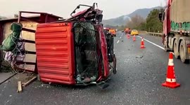 Truck collides head-on with car after crashing through highway's central reservation in China