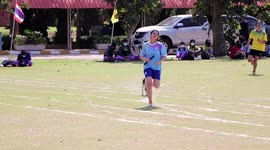 Competitive dog joins school sports day relay race