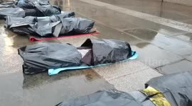 Protest Eight people play dead on a bodybags against Russian invasion