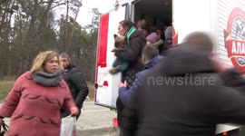 Families desperately try to flee Irpin, northwest of Kyiv, as explosions rock the city
