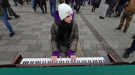 Music against war: woman plays piano outside Lviv's train station