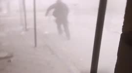 Strike in Irpin, Ukraine: man is downed by blast as civilians flee city