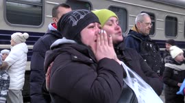 Tears and tension at Kyiv train station as thousands still try to flee