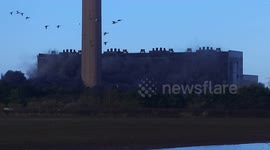 Section of power station brought down by controlled explosives in North Yorkshire, England