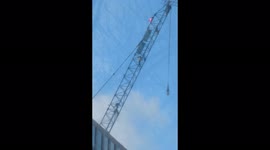 People climb 60ft crane at One Thames City, Nine Elms. Wandsworth Road closed in both directions. Emergency services on the scene
