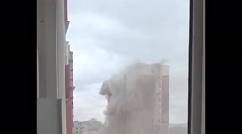 Russian shells hit residential building in Ukrainian town of Irpin