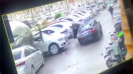 Lightning arrester crushes car after falling from building roof in China