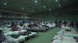 Hundreds of beds set up inside Moldovan sports arena to shelter Ukrainian refugees