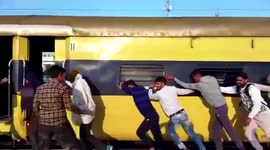 Passengers push train away from burning coaches in India