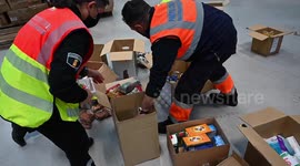 Workers prepare aid bound for Ukraine at Madrid hospital