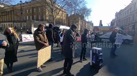 Anti Justin Trudeau protesters outside Downing Street during Trudeau's visit