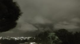 Resident films timelapse of menacing storm clouds shrouding Sydney's skyline