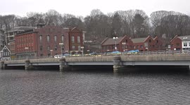 Bridge over Saugatuck River in downtown with yellow and blue ribbon like symbol for Ukraine war crisis.