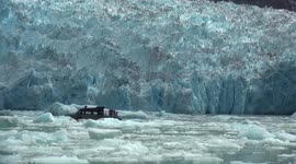 Huge chunk of glacier collapses into sea near boat in Alaska