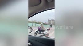 Man spotted riding three-wheeler being pulled by a dog in China