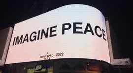 Yoko Ono’s Artwork “Imagine Peace” projected in Piccadilly Circus, London