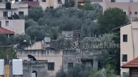 Smoke billows from the house of a Palestinian after it was demolished by Israeli security forces