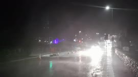 Large waves crash over the sea defenses in Torbay, UK