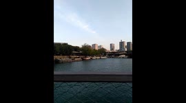 View from a boat at the Seine River in Paris, with sight over the Eiffel Tour