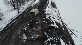 Ukrainian soldiers inspect destroyed column of Russian military vehicles after battle in Sumy
