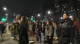 International women's day protesters perform a song with choreography for Boris Johnson outside Downing Street