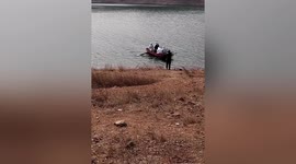 Medial workers take boat to reach villagers in China for COVID-19 tests