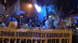 East Turkistan women hold a