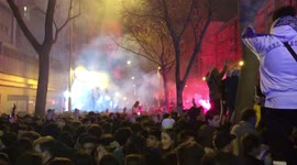 Real Madrid fans warm up the atmosphere in front of the Santiago Bernabéu before the match against PSG