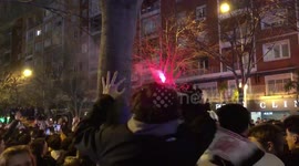 Real Madrid fan waves scarf minutes before PSG match outside Santiago Bernabéu stadium