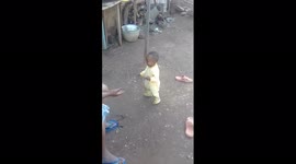 First baby steps. It's a balancing act. Granny and granddaughter.