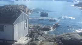Glacier calving creates wave which reaches Greenlandic Village