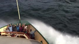 Locals getting soaked while traveling on manly ferry crossing Sydney heads