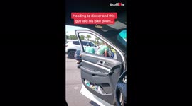 'Compassionate man steps out of his car to help out a motorcycle rider who had dropped his bike '