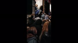 Chaos ensues in Kyiv as people try to jam into train