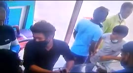 Watch - Chaos caught in cctv after a mobile phone battery caught fire at a mobile shop