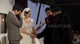 Elderly couple bring ring to their grandson's wedding in heartwarming scene